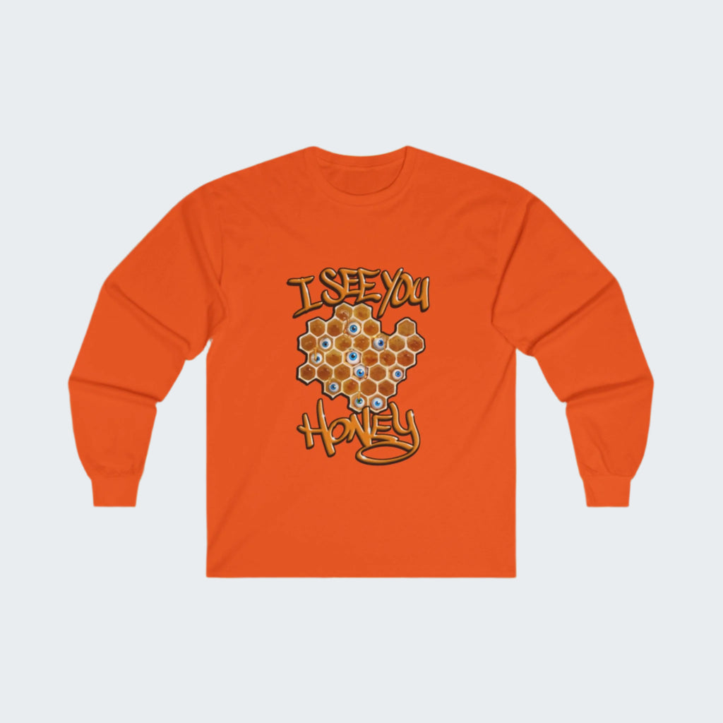 An orange long sleeve T-shirt with a honeycomb design and eyeball graphics, displayed against a honeycomb background.
