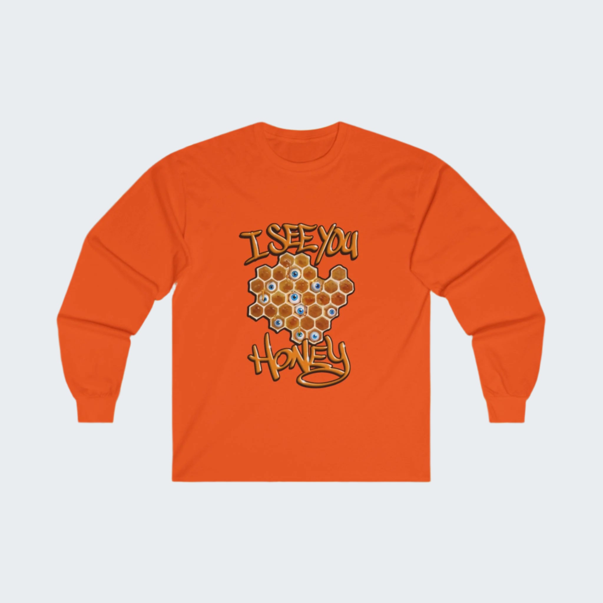 An orange long sleeve T-shirt with a honeycomb design and eyeball graphics, displayed against a honeycomb background.